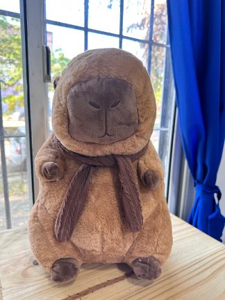Peluche capibara con mantas